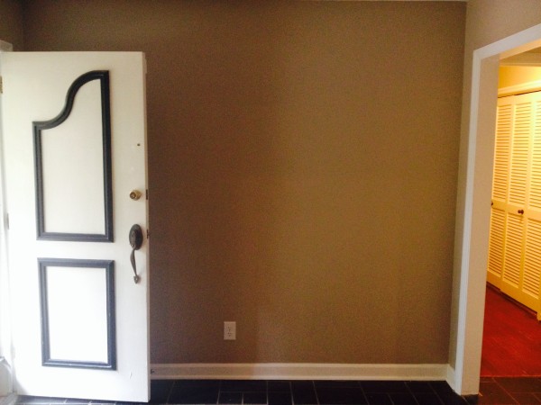 BEFORE: A 1970's brick ranch entry with slate flooring.